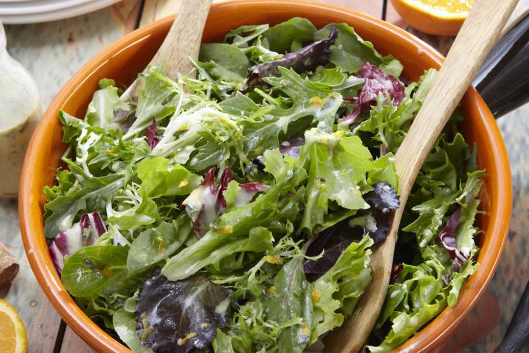 Mixed Baby Greens with Ginger Orange Dressing - Mazola® Oils