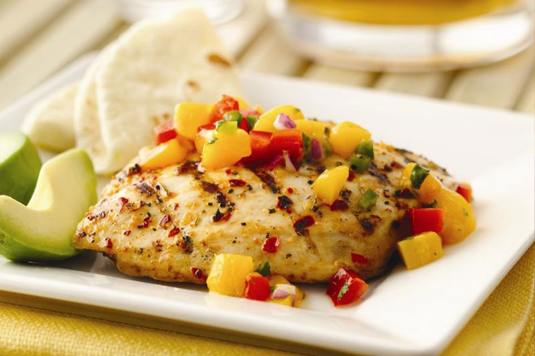 Spicy Chicken with Mango Salsa - Mazola® Oils