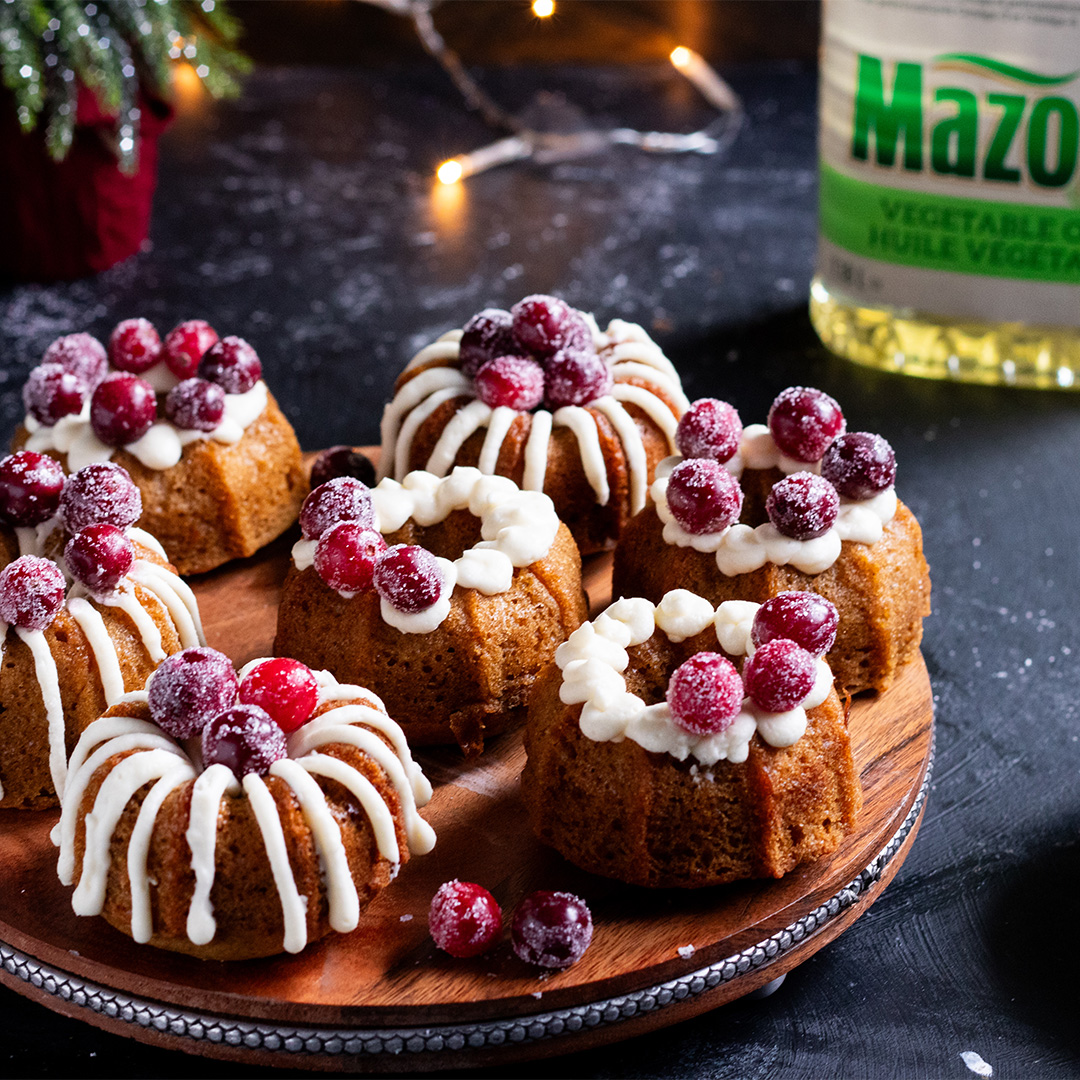 Mini Spiced Bundt Cakes with Cream Cheese Icing and Sugared Cranberries - Mazola® Oils